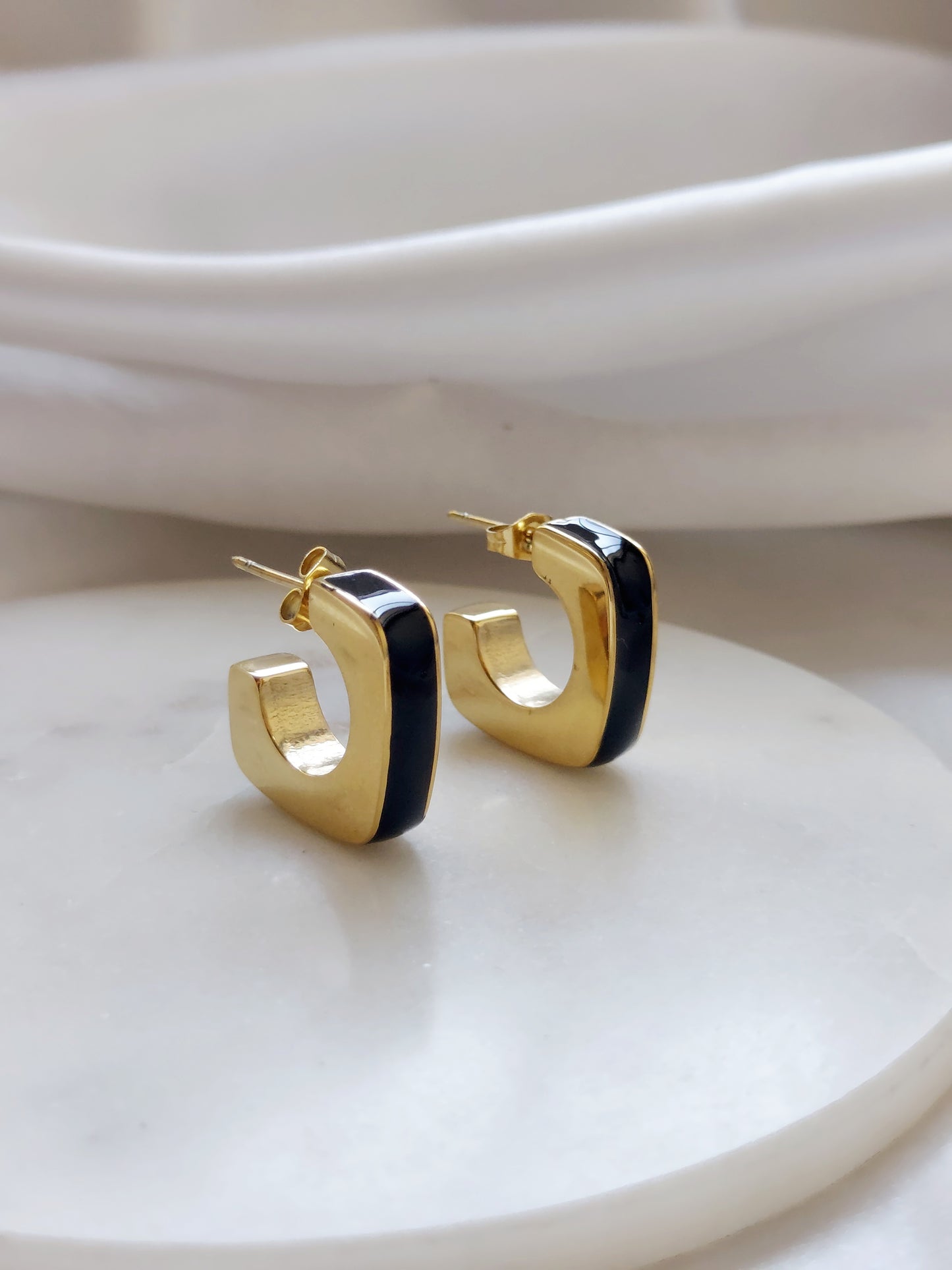 Huggie hoop earrings.